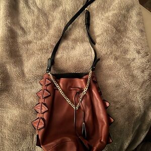 GG Maull Bombshell Bucket crossbody bag.